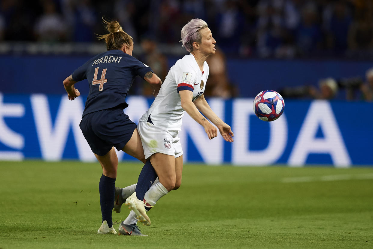 Megan Rapinoe (Reign FC) of United States and Marion Torrent (Montpellier HSC) of France battle for the ball during the 2019 FIFA Women's World Cup France Quarter Final match between France and USA at Parc des Princes on June 28, 2019 in Paris, France. (Photo by Jose Breton/NurPhoto via Getty Images)