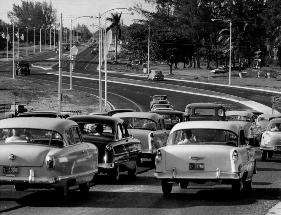 On the road to downtown Miami in 1956, cars travel on a new extension of 12th Avenue.