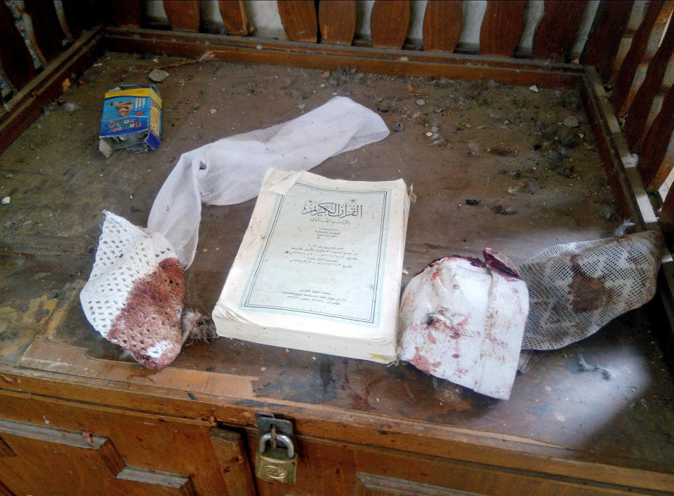 <p>A Quran and remnants of personal belongings of victims of the explosion are seen at Al Rawdah mosque are seen in Bir Al-Abed, Egypt, Nov. 25, 2017. (Photo: Mohamed Soliman/Reuters) </p>