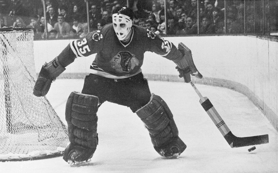 FILE - In this Jan. 25, 1970, file photo, Chicago Blackhawks goalie Tony Esposito moves behind the net to stop the puck for a teammate during an NHL hockey game against the Toronto Maple Leafs in Chicago. Esposito, a Hall of Fame goaltender who played almost his entire 16-year career with the Blackhawks, has died following a brief battle with pancreatic cancer, the team announced Tuesday, Aug. 10, 2021. He was 78. (AP Photo/Fred Jewell, File)