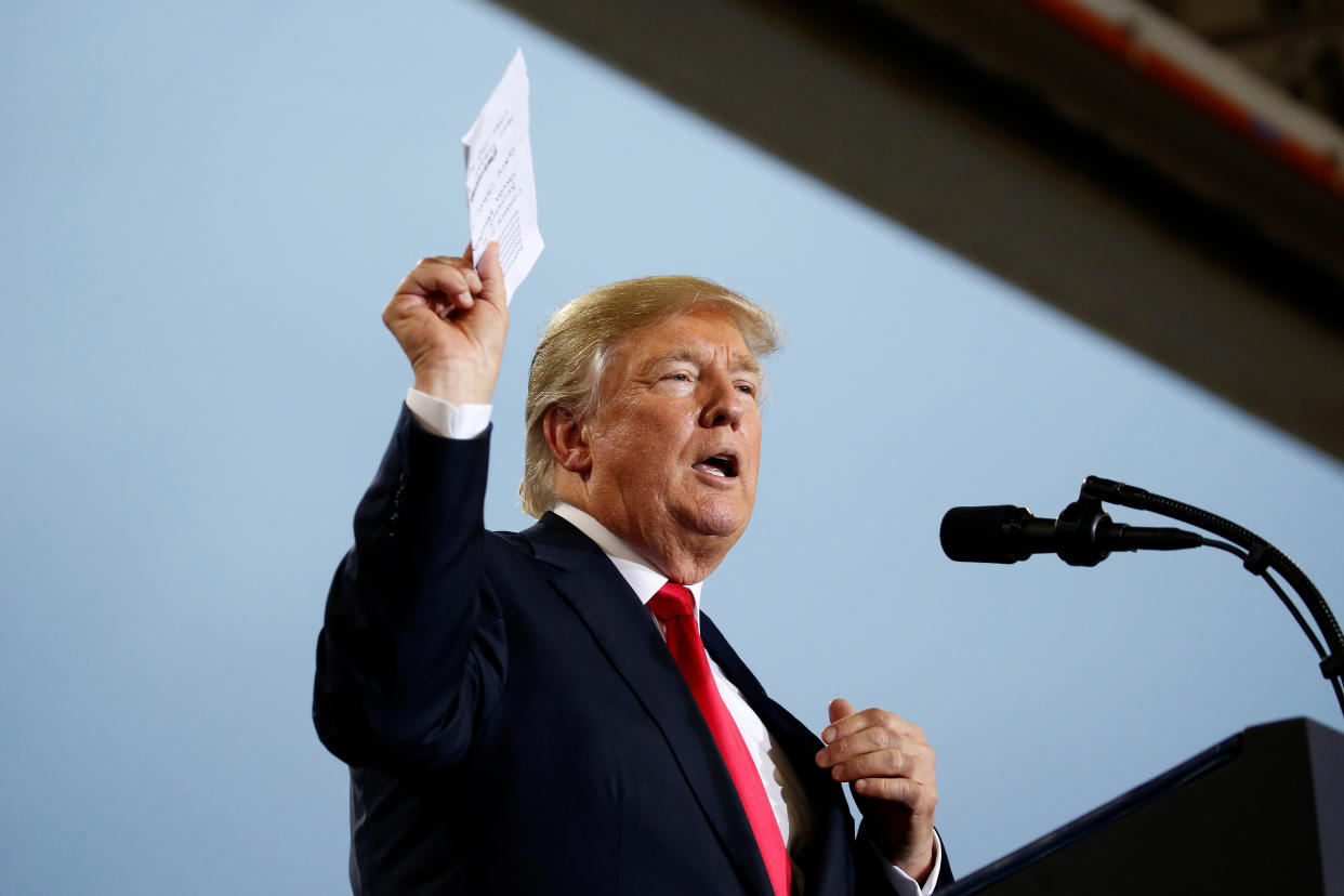 President Donald Trump holds up a list of politicians as he speaks about tax reform in Harrisburg, Pennsylvania, U.S., October 11, 2017. (Photo: Joshua Roberts/Reuters)