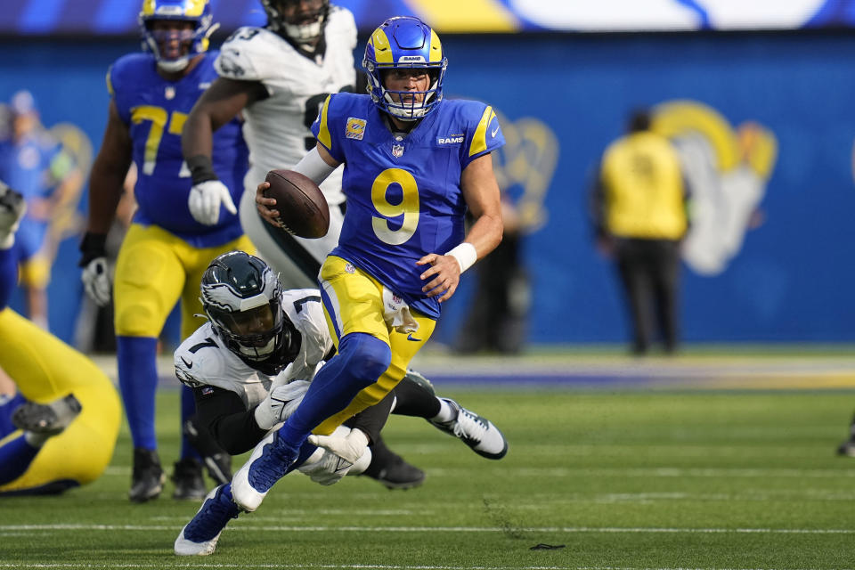 Los Angeles Rams quarterback Matthew Stafford, right, is tackled by Philadelphia Eagles linebacker Haason Reddick during the second half of an NFL football game Sunday, Oct. 8, 2023, in Inglewood, Calif. (AP Photo/Gregory Bull)