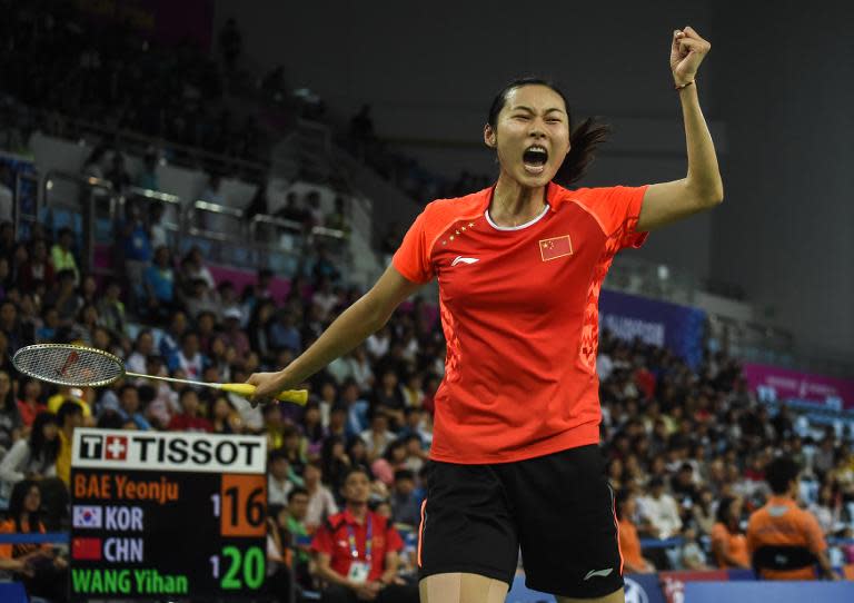 Wang Yihan, pictured here at the 2014 Incheon Asian Games, had to battle to qualify for the quarter-finals at the All-England championships after losing leads and not converting game points