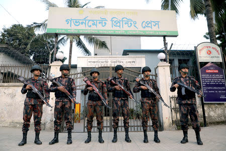 Members of the Border Guard Bangladesh (BGB) stand guard in front of Bangladesh Government Printing Press ahead of the 11th general election in Dhaka, Bangladesh, December 28, 2018. REUTERS/Mohammad Ponir Hossain