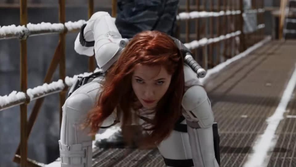 natasha romanoff lands in a scene from black widow, the 24th movie if you want to watch all the marvel movies in order