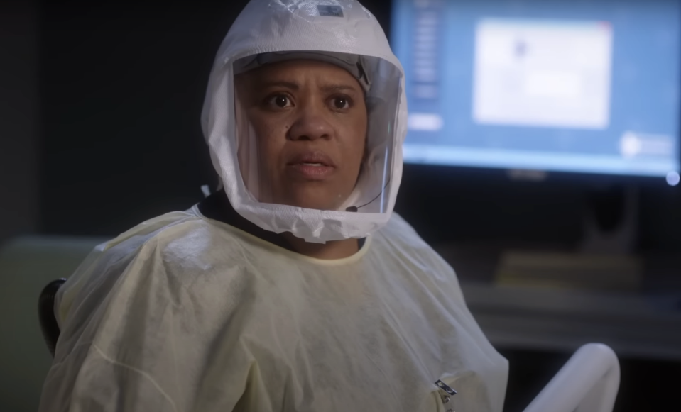 Dr Miranda Bailey on Grey's Anatomy wearing a hazmat suit and looking concerned