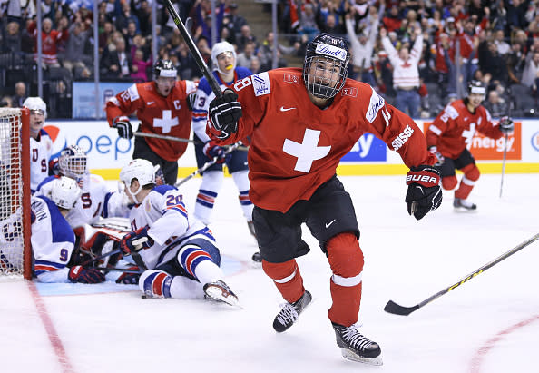 TORONTO, ON - JANUARY 2: Nico Hischier #18 of Team Switzerland celebrates one of his 2 goals against Team USA during a QuarterFinal game at the 2017 IIHF World Junior Hockey Championships at Air Canada Centre on January 2, 2017 in Toronto, Ontario, Canada. Team USA defeated Team Switzerland 3-2. (Photo by Claus Andersen/Getty Images)