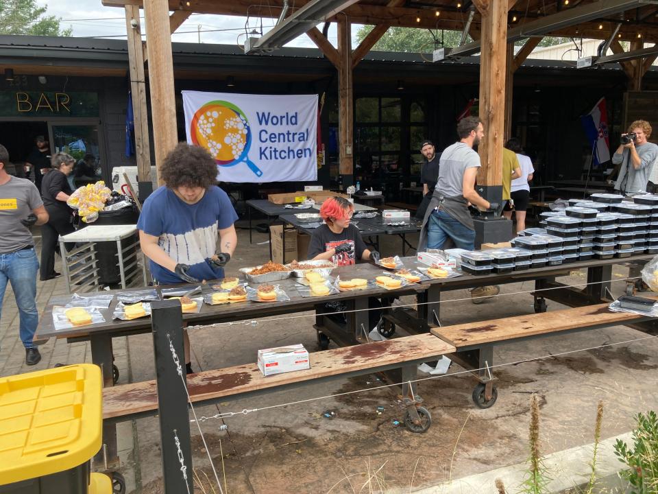 World Central Kitchen volunteers prepare hot meals for distribution at Bear's Smokehouse, available beginning at Noon on Sept. 30, at 135 Coxe Ave. downtown Asheville.