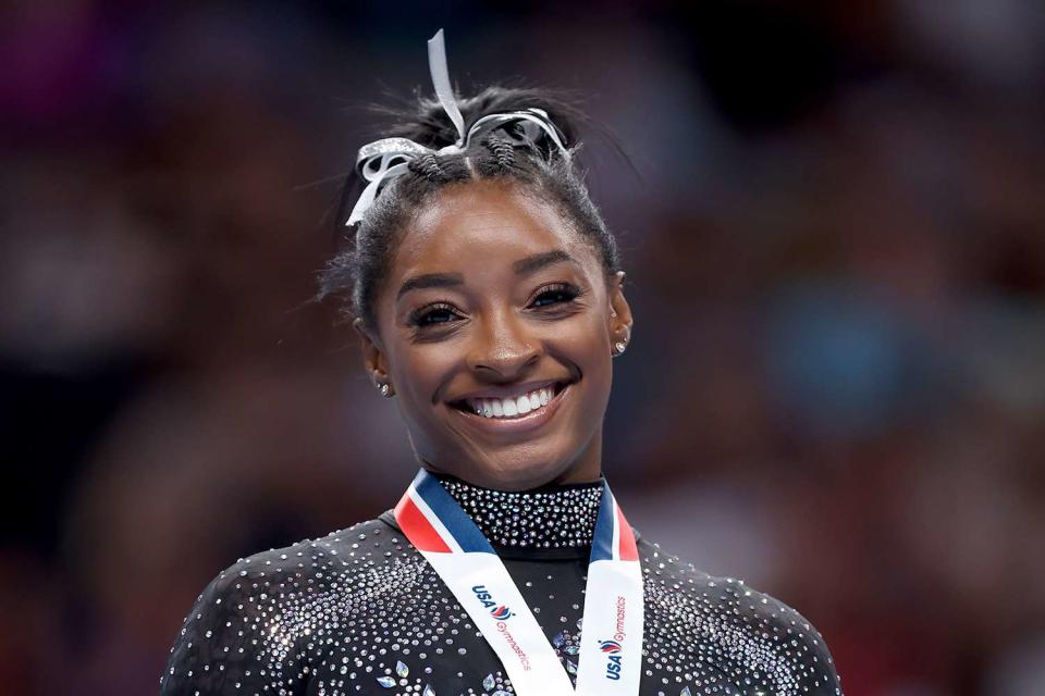 <p>Ezra Shaw/Getty </p> Simone Biles has made history as the first U.S. woman to be selected for six World Championship squads.