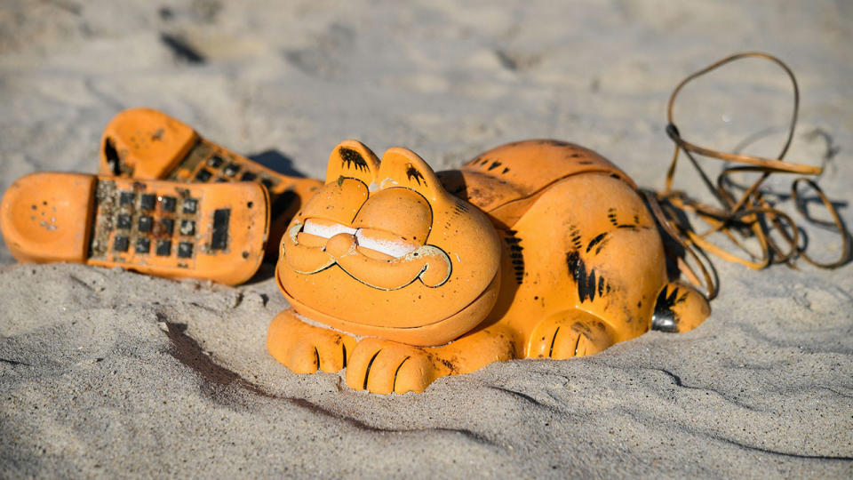 Divers recently located the remnants of a shipping container that presumably carried a load of Garfield phones, solving a 30-year mystery. Source: Fred Tanneau/AFP/Getty Images