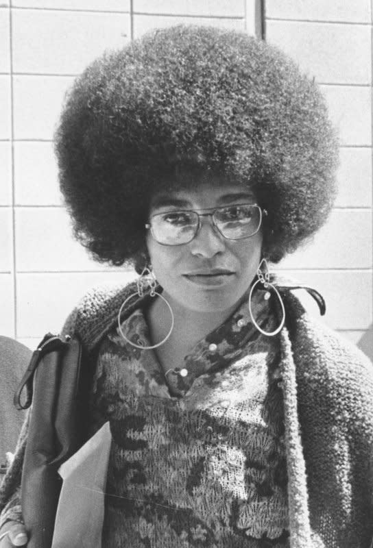 Angela Davis leaves the Santa Clara County Courthouse during a noon recess in 1972. On this day in that same year, Davis was acquitted of murder, kidnapping and criminal conspiracy charges stemming from a California courtroom shootout in which a judge and three other people were killed. UPI File Photo