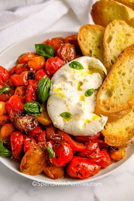 <p>Spend with Pennies</p><p>Burrata is one of my all time favorite creamy cheeses and it’s amazing served with roasted balsamic tomatoes.</p><p><strong>Get the recipe: <a href="https://www.spendwithpennies.com/burrata-with-balsamic-tomatoes/" rel="nofollow noopener" target="_blank" data-ylk="slk:Burrata with Balsamic Tomatoes;elm:context_link;itc:0;sec:content-canvas" class="link rapid-noclick-resp"><em>Burrata with Balsamic Tomatoes</em></a></strong></p>