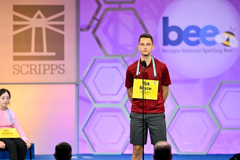 Bryce Beckley listens to Scripps National Spelling Bee Prounouncer Jacques Bailly on Tuesday, May 30, 2023, during the first round of the bee. Beckley incorrectly spelled his word and was eliminated from the bee.