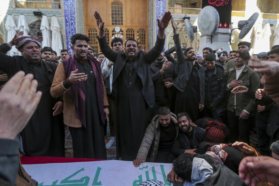 Iraqis attend the funeral of Popular Mobilization Forces fighters killed in the U.S. airstrikes at the Imam Ali shrine in Najaf, Iraq, Sunday, Feb. 4, 2024. (AP Photo/Anmar Khalil)