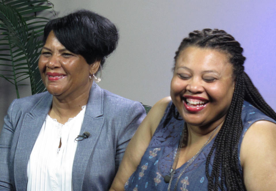 Alice Marie Johnson (left), who was released from prison Wednesday, waits with her daughter, Katina Marie Scales, for a TV interview on Thursday. (Photo: Adrian Sainz/AP).