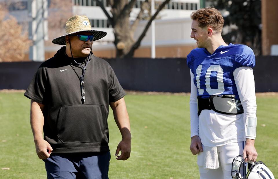 Head coach Kalani Sitake, talks with quarterback Kedon Slovis after the BYU Cougars football team practiced in Provo on Friday, March 17, 2023. | Scott G Winterton, Deseret News