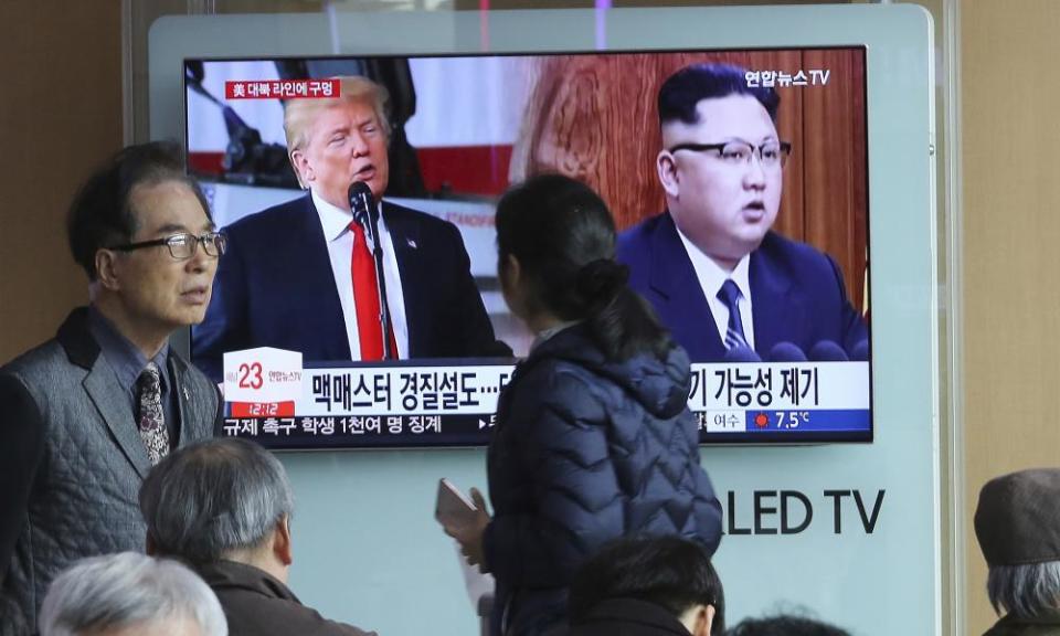 North Korean leader Kim Jong Un, right, and US President Donald Trump during a news program at the Seoul Railway Station