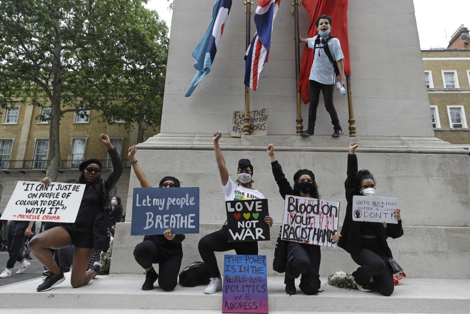 Protesters on Whitehall in London, Wednesday, June 3, 2020 during a demonstration over the death of George Floyd, a black man who died after being restrained by Minneapolis police officers on May 25. Protests have taken place across America and internationally, after a white Minneapolis police officer pressed his knee against Floyd's neck while the handcuffed black man called out that he couldn't breathe. The officer, Derek Chauvin, has been fired and charged with murder. (AP Photo/Kirsty Wigglesworth)