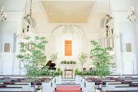 <p>Trees are so often associated with family, so why not celebrate the start of your own by lining your aisle with real saplings? This elegant look, courtesy Carter, accentuates the height of the church setting and provides a lush counterpoint to the all-white interiors. </p>