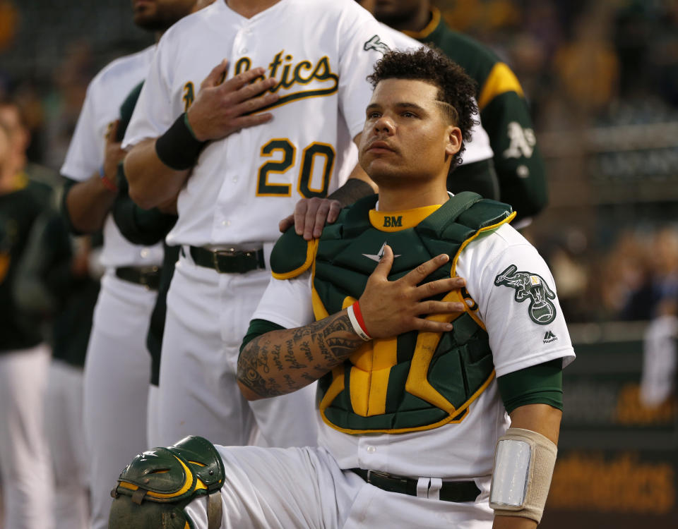 Oakland Athletics' Bruce Maxwell (13) kneels next to Oakland Athletics' Mark Canha (20) during the National Anthem before their game against the Seattle Mariners at the Coliseum in Oakland, Calif., on Monday, September 25, 2017. (Nhat V. Meyer/Bay Area News Group) (Photo by MediaNews Group/Bay Area News via Getty Images)