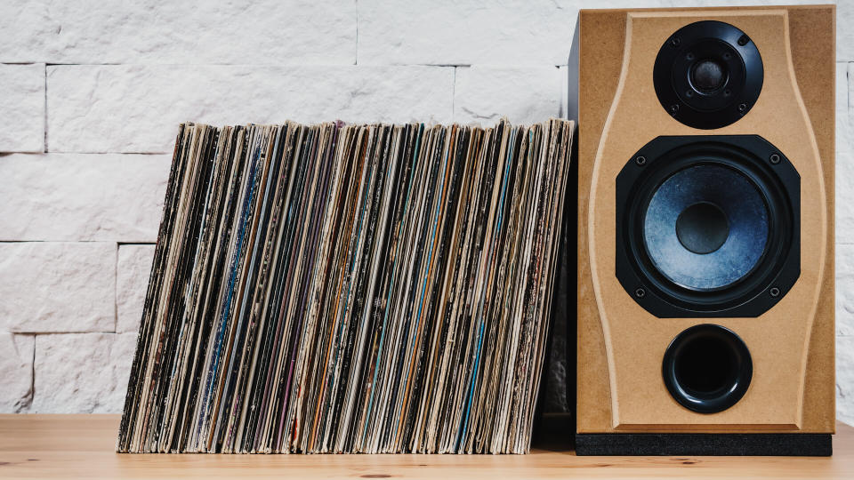 wooden shelf full of old vinyl records and speaker - Image.