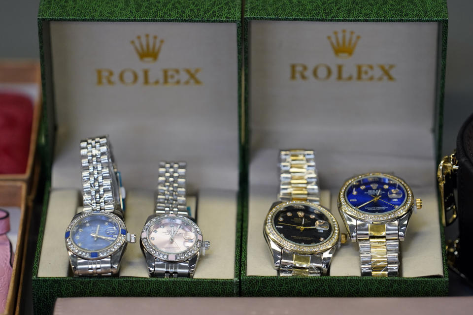 Fake Rolex watches are displayed at the U.S. Customs and Border Protection overseas mail inspection facility at Chicago's O'Hare International Airport Feb. 23, 2024, in Chicago. The explosive growth of cross-border e-commerce involving major China-backed players such as Shein and Temu has caught the attention of the U.S. lawmakers amid a bitter U.S.-China trade war and cast a spotlight on a tax rule that critics say has allowed hundreds of millions of China-originated packages to enter the U.S. market each year without duty and without reliable information for lawfulness. (AP Photo/Charles Rex Arbogast)