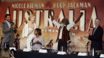 FILE - Australian actors from left, Hugh Jackman, Nicole Kidman, Brandon Walters and director Baz Luhrmann, right, applaud as Indigenous actor David Gulpilil, second right, arrives for a press conference for their latest movie "Australia" in Sydney, Tuesday, Nov. 18, 2008. Gulpilil has died of lung cancer, a government leader said on Monday, Nov. 29, 2021. He was 68 years old. (AP Photo/Mark Baker, File)