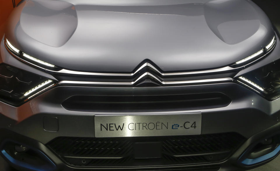 The Citroen e-C4 all electric hatchback is display during a media presentation in Paris, Tuesday, June 30, 2020. PSA Group's Citroen Brand is showing off a new version of its C4 compact hatchback, a model that will be key to the company's sales prospects as it faces a highly competitive European car market that faces severe headwinds from the coronavirus. (AP Photo/Michel Euler)