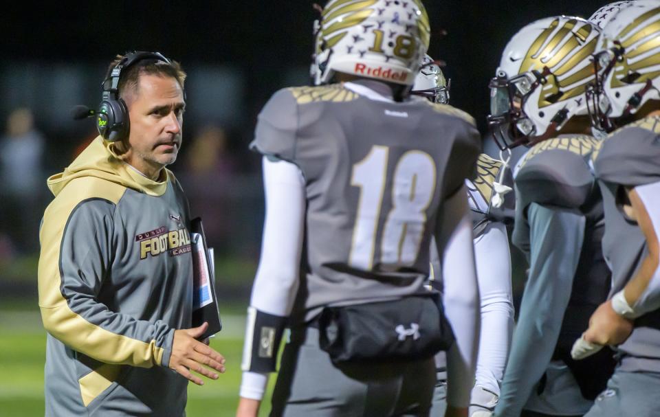 Dunlap head coach Brett Cazelet talks with his team as they fall behind Washington in the second half of their Week 7 football game Friday, Oct. 6, 2023 at Dunlap High School.