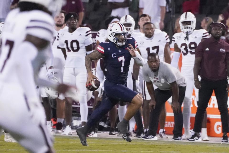 Arizona quarterback Jayden de Laura (7) runs but fails to get a first down against Mississippi State