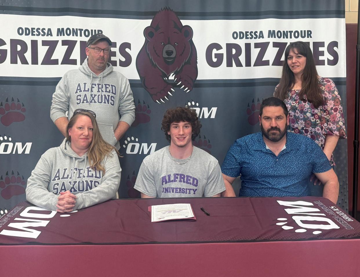 Odessa-Montour senior Bradley Gillis' decision to sign with Alfred University for football was celebrated during a ceremony March 27, 2024 at the O-M cafeteria. Also pictured are his parents, Martha Henry and Matthew Gillis; his stepfather, Michael Henry, and his stepfather's girlfriend.