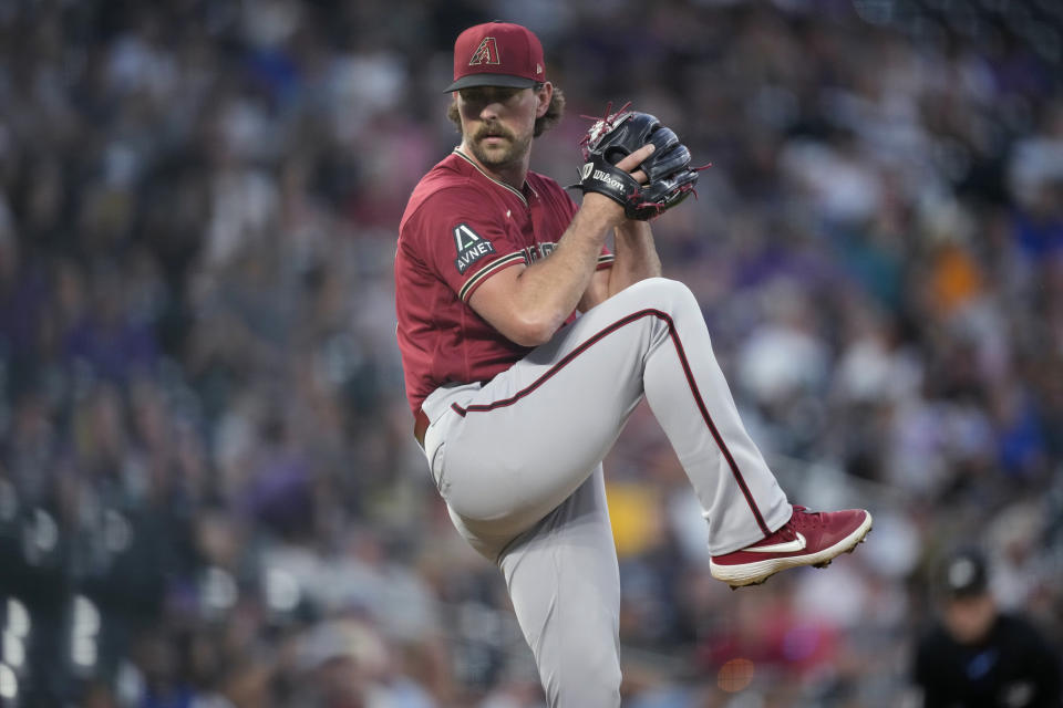 Arizona Diamondbacks relief pitcher Tyler Gilbert works against the Colorado Rockies during the fifth inning of a baseball game Tuesday, Aug. 15, 2023, in Denver. (AP Photo/David Zalubowski)