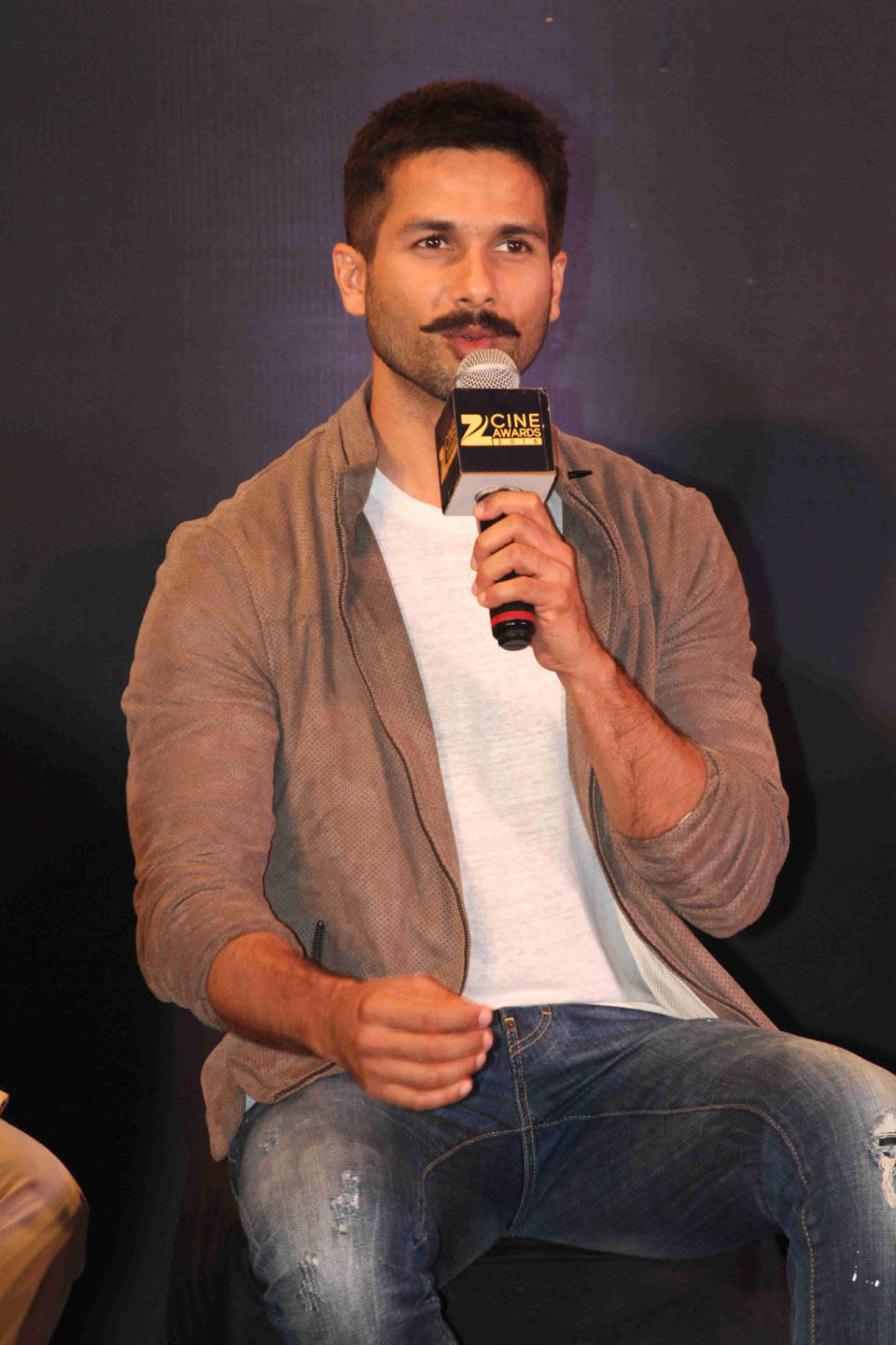 Shahid shows of his handlebar moustache
