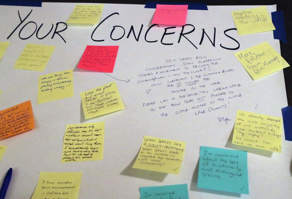 Akron residents share their concerns about the potential development of the wetlands off White Pond Drive during a public engagement session.