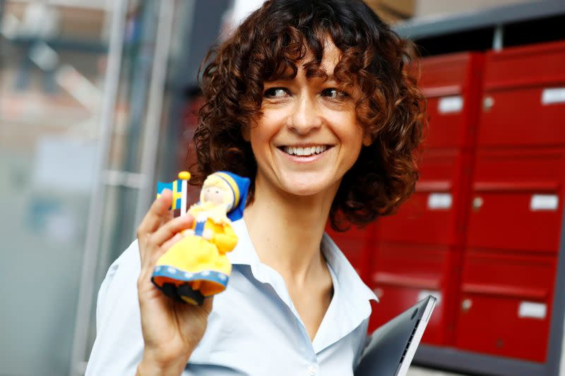 Scientist Emmanuelle Charpentier, director of the Max Planck Institute for Infection Biology in Berlin holds a swedish themed puppet after winning the 2020 Nobel Prize in Chemistry for the development of a method for genome editing, in Berlin