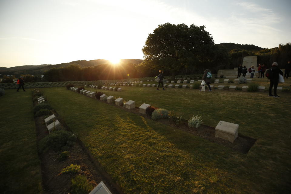 Following the dawn service commemorating the World War I landing of the ANZACs, people walk at the Anzac Cove cemetery by the site on the Gallipoli peninsula. Source: AAP, file
