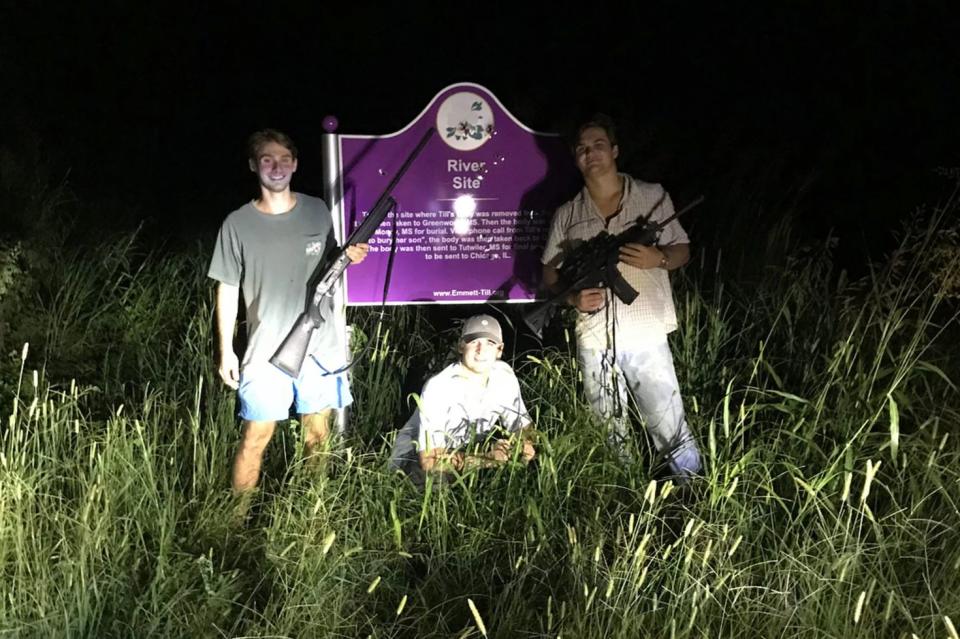 From left to right, Ole Miss students Ben LeClere, John Howe, and Howell Logan posing with guns by the bullet-ridden plaque marking the place where the body of murdered civil rights icon Emmett Till was pulled from the Tallahatchie River. The photo was posted to LeClere's Instagram account in March.  (Photo: Courtesy ProPublica and the Mississippi Center for Investigative Reporting )