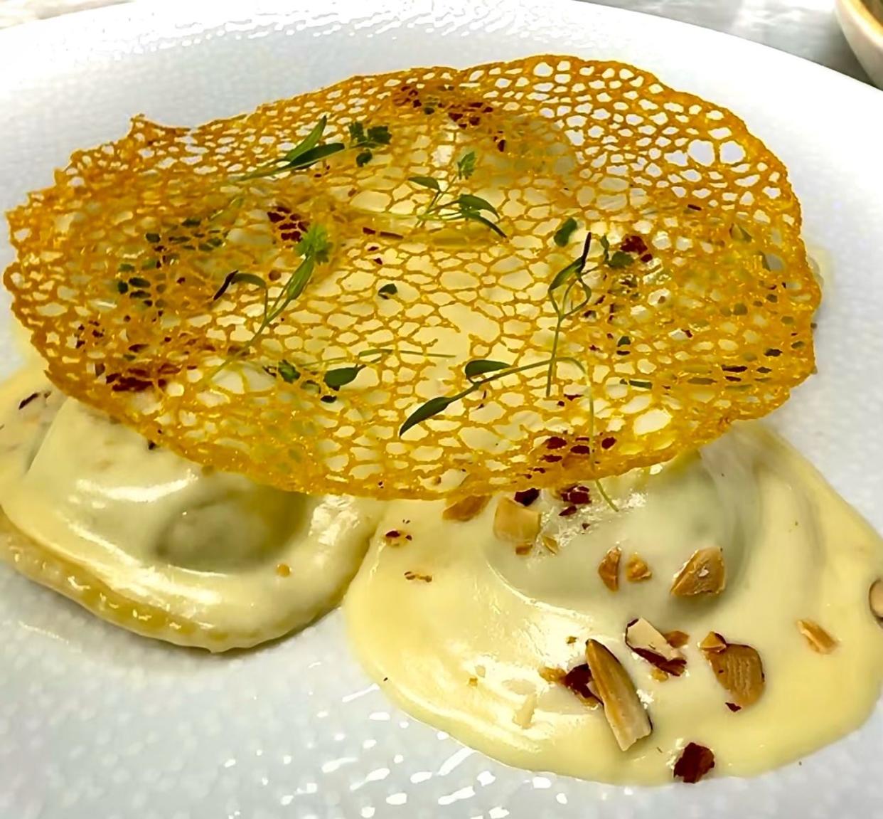 Homemade crab and spinach filled ravioli are made rich with mascarpone and ricotta cheeses and served in an asiago amaretto cream sauce as a special at Tavolena Italian restaurant in Jupiter.