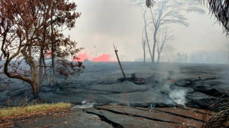 Lava is seen spewing from fissures in Pahoa, May 22, 2018. Kris Burmeister/via REUTERS