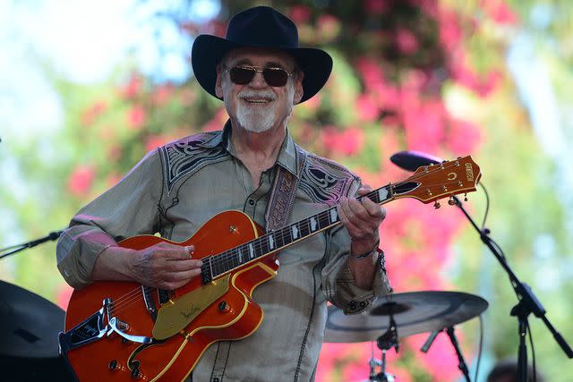 <p>Frazer Harrison/Getty</p> Duane Eddy on stage at Stagecoach Festival in Indio, California in April 2014