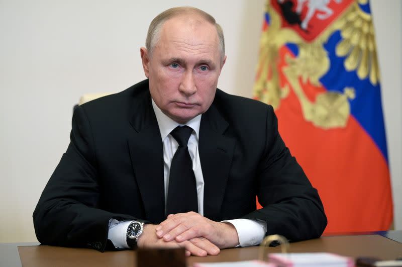 FILE PHOTO: Russian President Vladimir Putin attends a meeting with head of the Central Election Commission Ella Pamfilova, via a video conference call outside Moscow