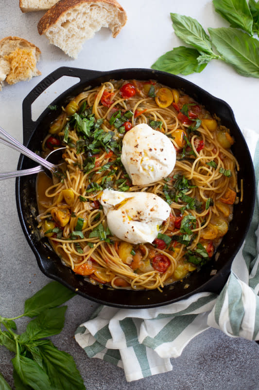 <p>The Baker Chick</p><p>A super easy and fast dinner, with a juicy tomato pan sauce and creamy burrata on top.</p><p><strong>Get the recipe: <a href="https://www.thebakerchick.com/one-pot-burrata-caprese-pasta/" rel="nofollow noopener" target="_blank" data-ylk="slk:One-Pot Burrata Caprese Pasta;elm:context_link;itc:0;sec:content-canvas" class="link rapid-noclick-resp"><em>One-Pot Burrata Caprese Pasta</em></a></strong></p>