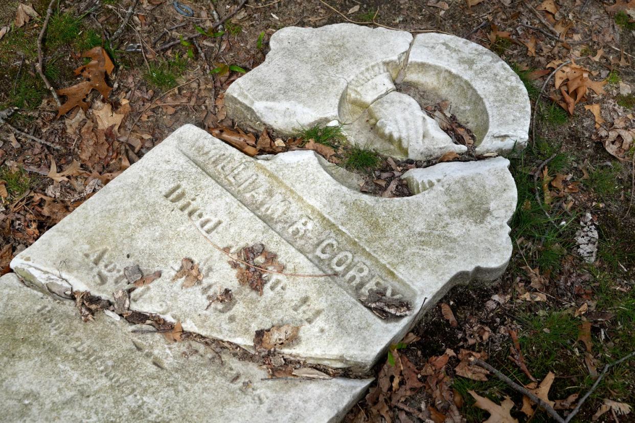 The original gravestone for Civil War veteran William Corey in R.I. Historical Cemetery Warwick 1. The vandalized stone was left on the ground and a new marker for Corey was placed over the grave.