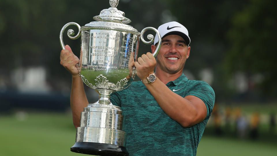   Brooks Koepka with the trophy after winning the 2018 PGA Championship at Bellerive Country Club 