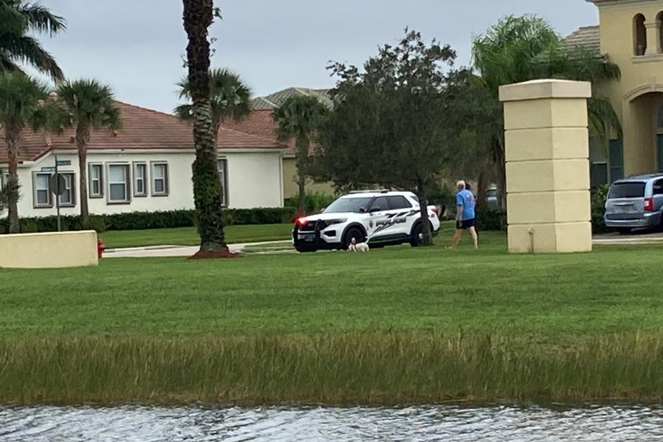 Port St. Lucie police vehicle in the area of Southwest Kingslake Circle in Town Park community on Dec. 13, 2023, in the area where a man shot earlier in the morning fled.