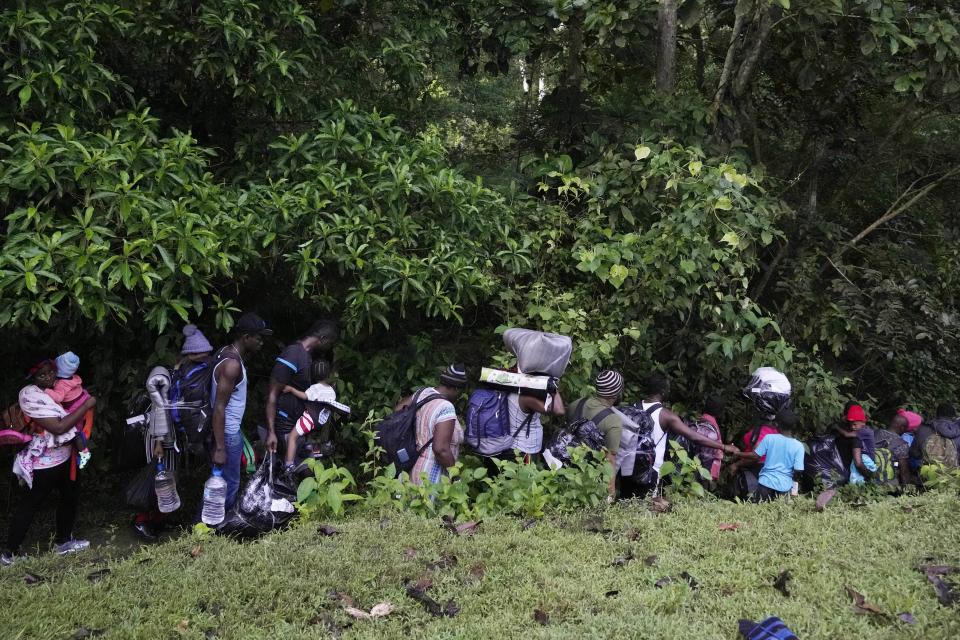 Migrants continue their trek north, near Acandi, Colombia, Wednesday, Sept. 15, 2021. The migrants, mostly Haitians, are on their way to crossing the Darien Gap from Colombia into Panama dreaming of reaching the U.S. (AP Photo/Fernando Vergara)