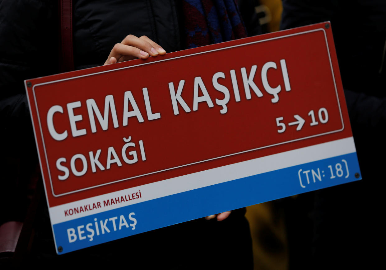 A member of Amnesty International Turkey holds a symbolic street sign during a demonstration to mark the 100th day of Jamal Khashoggi's killing in front of Saudi Arabia's Consulate in Istanbul, Turkey January 10, 2019. (Photo: Reuters/Murad Sezer)