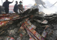 <p>Firefighters work at the site of an explosion at a firecracker factory in Tangerang, on the outskirt of Jakarta, Indonesia, Thursday, Oct. 26, 2017. (Photo: Tatan Syuflana/AP) </p>