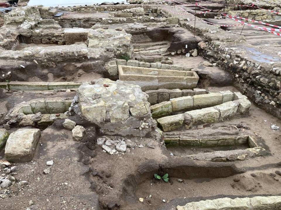 A collection of stone sarcophagi unearthed in one of the abbey’s houses. Photo by Jean Demerliac from INRAP