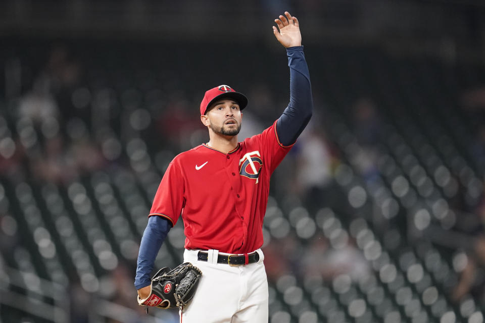 Minnesota Twins relief pitcher Jovani Moran reacts during the ninth inning of the team's baseball game against the Kansas City Royals, Tuesday, Sept. 13, 2022, in Minneapolis. (AP Photo/Abbie Parr)